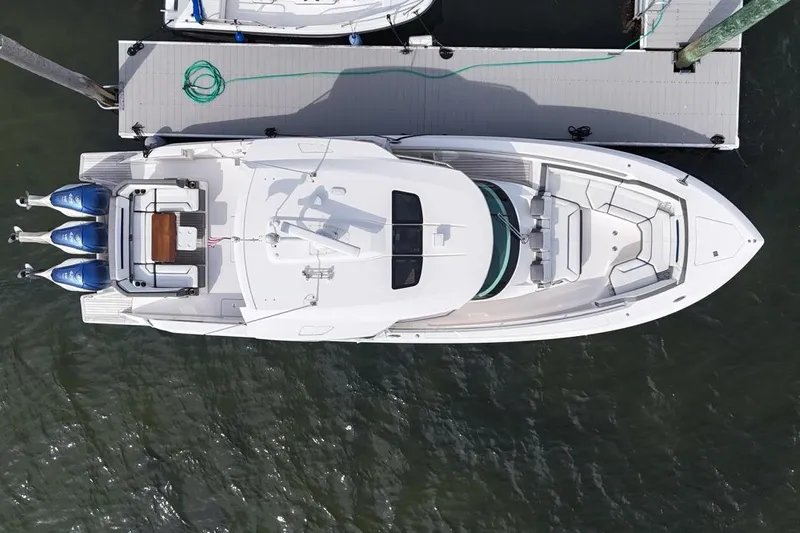 Carry On Yacht Photos Pics Aerial view of 2021 Tiara Sport 43 LS yacht docked at a marina.
