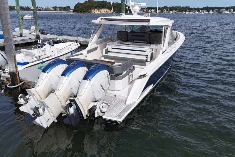 Carry On Yacht Photos Pics 2021 Tiara Sport 43 LS boat docked with triple outboard engines.