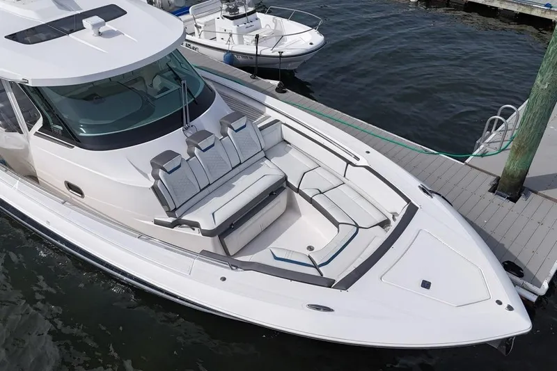 Carry On Yacht Photos Pics 2021 Tiara Sport 43 LS luxury boat docked, featuring sleek design and spacious seating.
