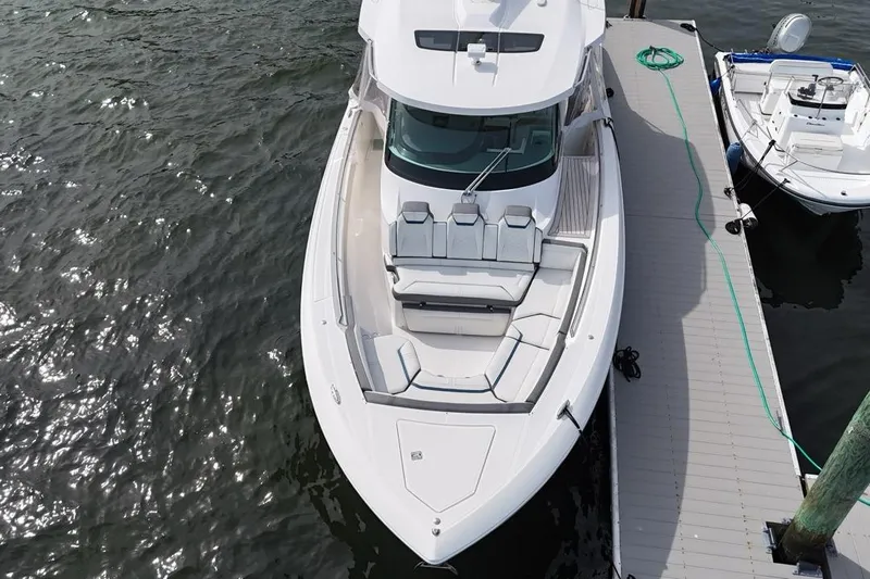 Carry On Yacht Photos Pics 2021 Tiara Sport 43 LS luxury boat docked, aerial view.