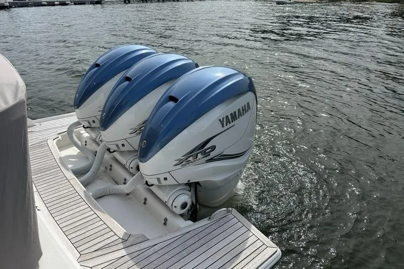 Carry On Yacht Photos Pics Triple Yamaha outboard engines on a 2021 Tiara Sport 43 LS boat, docked on water.
