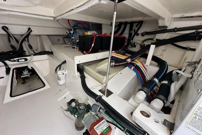 Carry On Yacht Photos Pics Engine compartment of 2021 Tiara Sport 43 LS with wiring and components visible.