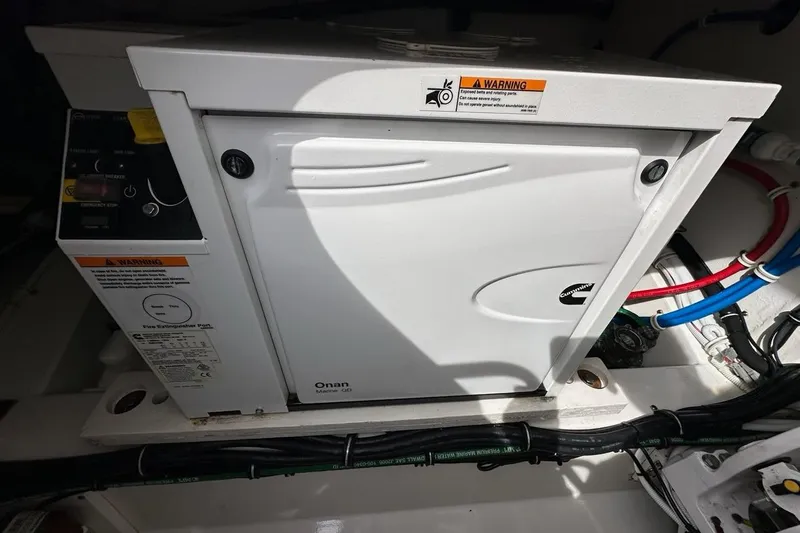 Carry On Yacht Photos Pics Onan Marine generator in a 2021 Tiara Sport 43 LS boat engine compartment.