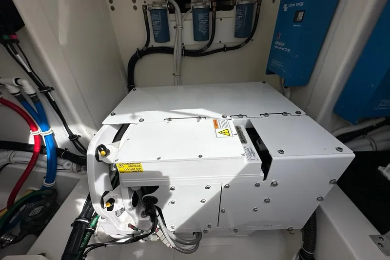 Carry On Yacht Photos Pics Engine compartment of 2021 Tiara Sport 43 LS boat, showcasing electrical components and wiring.