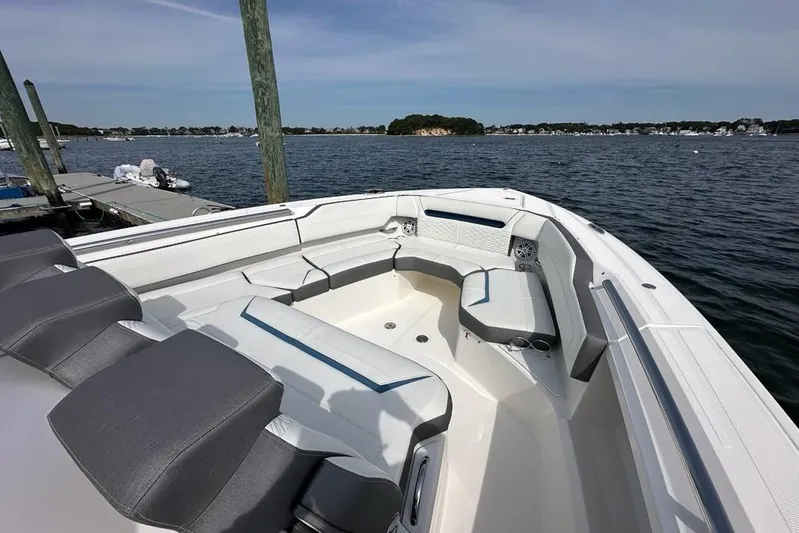 Carry On Yacht Photos Pics 2021 Tiara Sport 43 LS boat interior with seating, docked by the water.