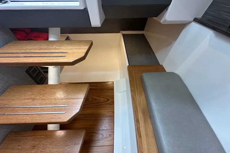 Carry On Yacht Photos Pics Interior of 2021 Tiara Sport 43 LS yacht with wooden steps and seating.