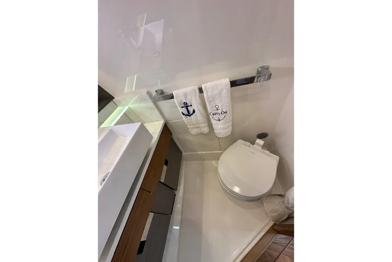 Carry On Yacht Photos Pics Bathroom interior of 2021 Tiara Sport 43 LS yacht with modern fixtures.