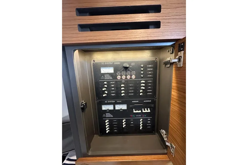 Carry On Yacht Photos Pics Electrical panel inside 2021 Tiara Sport 43 LS boat, featuring DC and AC systems.