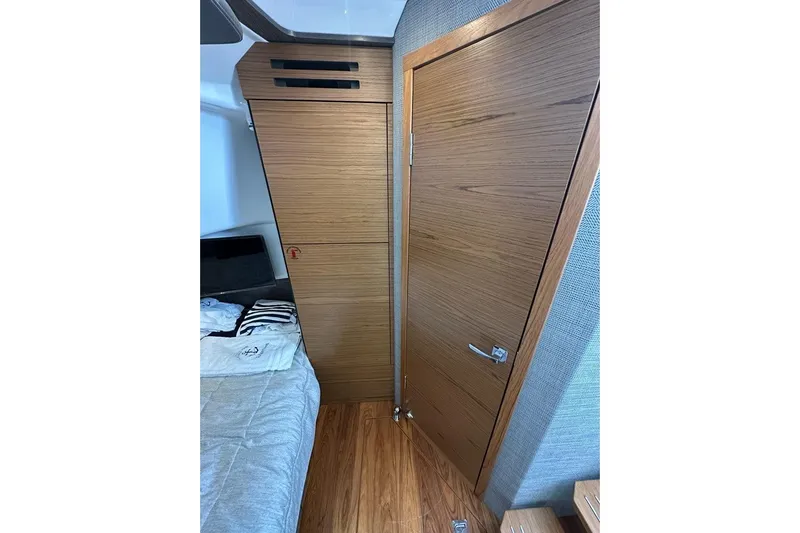 Carry On Yacht Photos Pics Interior of 2021 Tiara Sport 43 LS, featuring wooden cabinetry and door.