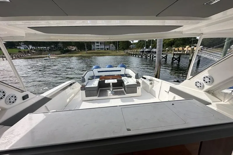 Carry On Yacht Photos Pics 2021 Tiara Sport 43 LS yacht interior with spacious seating and scenic waterfront view.