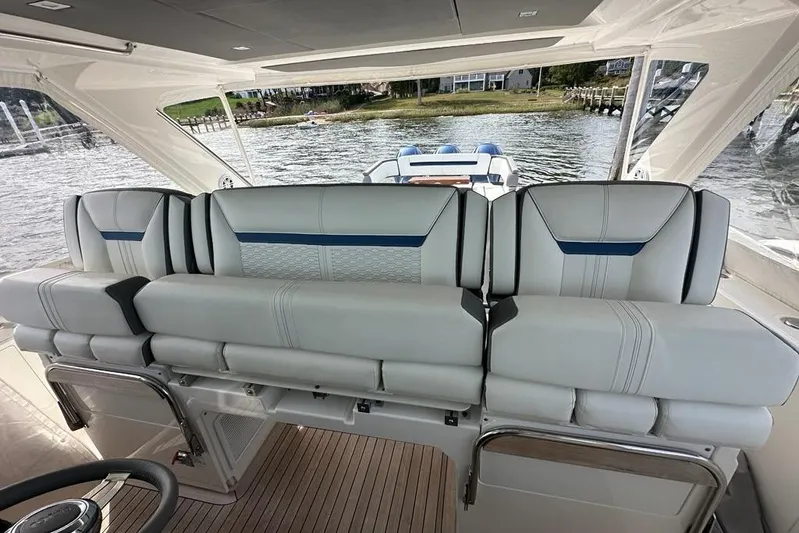 Carry On Yacht Photos Pics 2021 Tiara Sport 43 LS boat interior with luxurious seating and scenic water view.