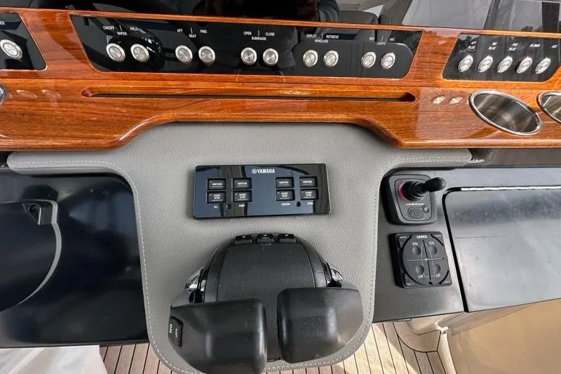 Carry On Yacht Photos Pics Dashboard of 2021 Tiara Sport 43 LS boat with Yamaha controls and wooden paneling.