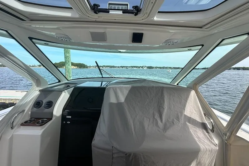Carry On Yacht Photos Pics Interior view of 2021 Tiara Sport 43 LS boat with scenic water backdrop.