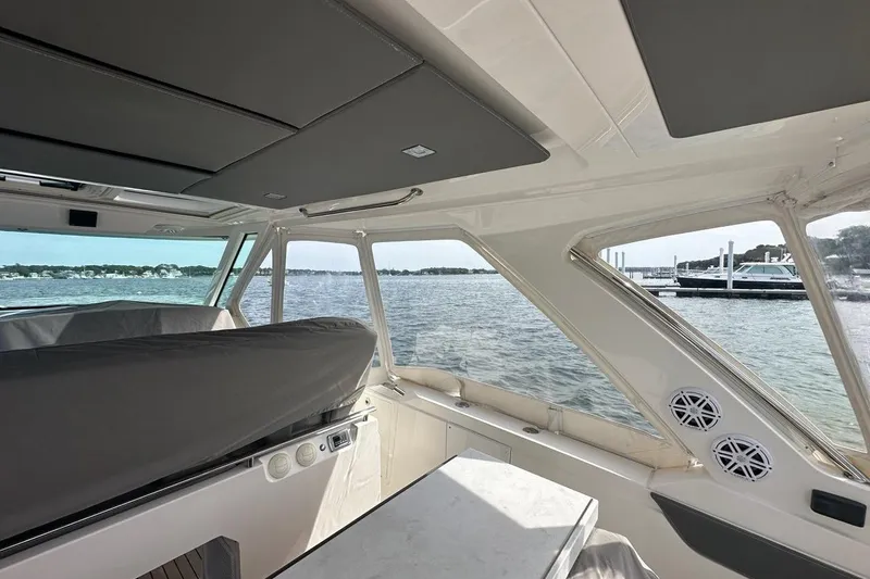 Carry On Yacht Photos Pics Interior view of 2021 Tiara Sport 43 LS yacht with scenic water backdrop.