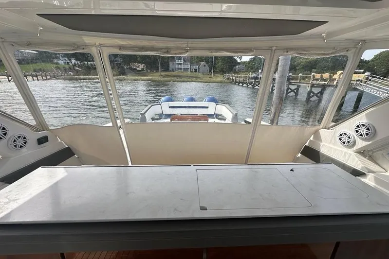 Carry On Yacht Photos Pics 2021 Tiara Sport 43 LS boat interior with waterfront view and modern amenities.