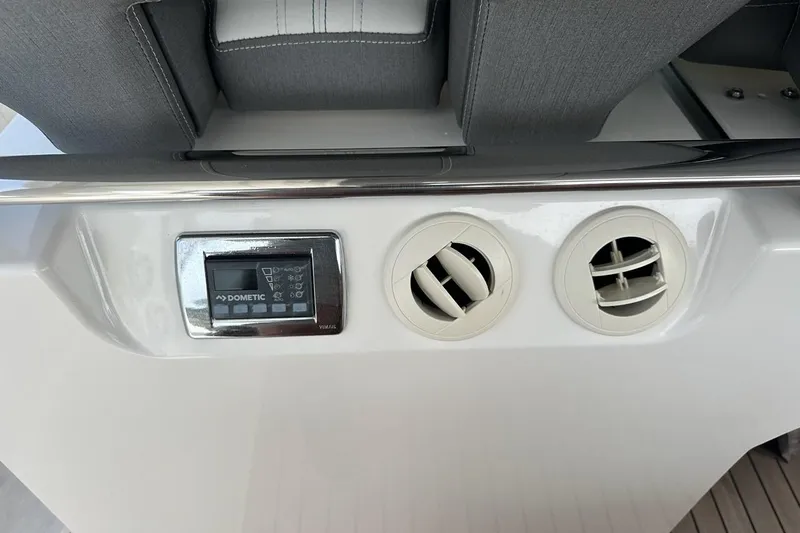 Carry On Yacht Photos Pics 2021 Tiara Sport 43 LS boat interior with Dometic control panel and air vents.