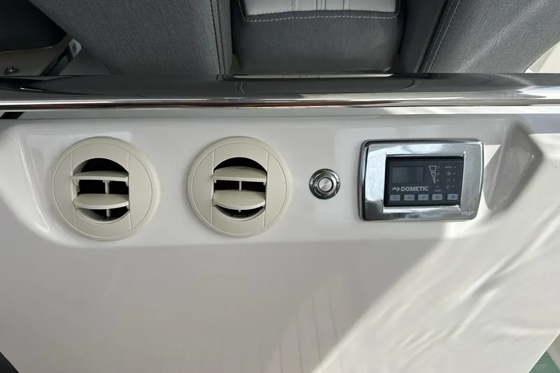 Carry On Yacht Photos Pics 2021 Tiara Sport 43 LS dashboard with air vents and Dometic control panel.