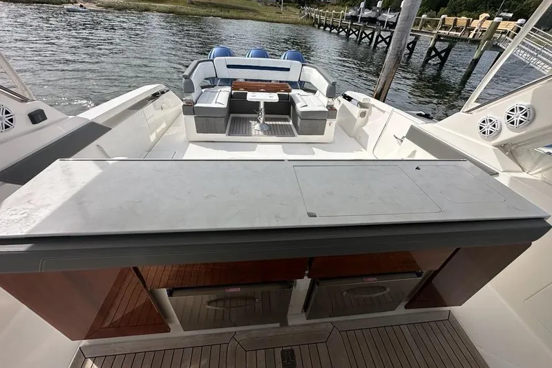 Carry On Yacht Photos Pics 2021 Tiara Sport 43 LS luxury boat interior with seating and outdoor kitchen.