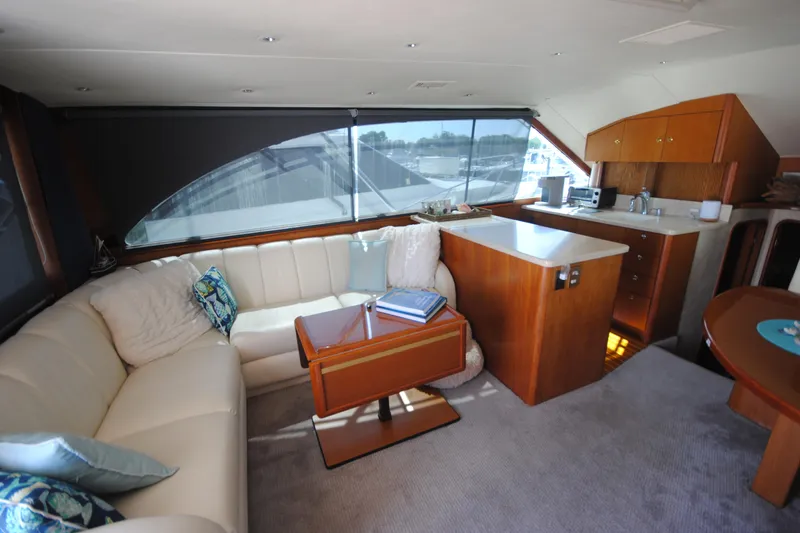  Yacht Photos Pics Luxurious interior of a 1999 Ocean Yachts 45 Super Sport with elegant seating and kitchenette.