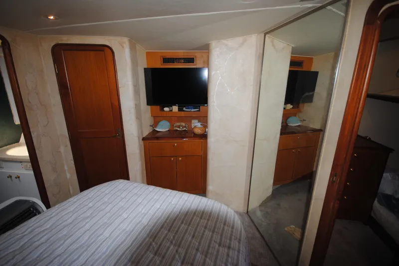  Yacht Photos Pics Interior of 1999 Ocean Yachts 45 Super Sport with TV and wooden cabinetry.