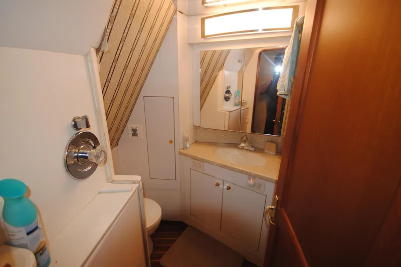  Yacht Photos Pics Bathroom interior of 1999 Ocean Yachts 45 Super Sport with sink and shower.