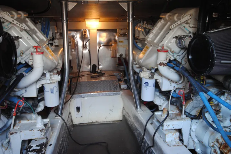  Yacht Photos Pics Engine room of 1999 Ocean Yachts 45 Super Sport, showcasing dual engines and mechanical components.