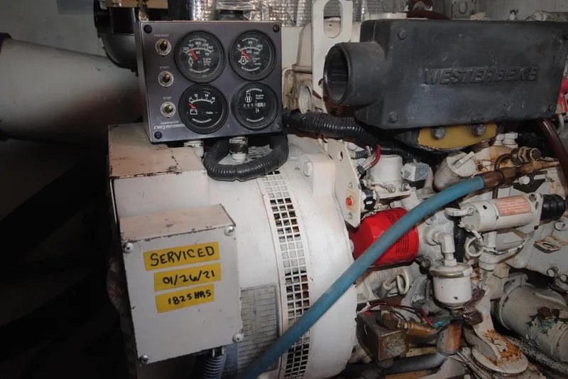  Yacht Photos Pics Engine compartment of a 1999 Ocean Yachts 45 Super Sport, showing gauges and service label.