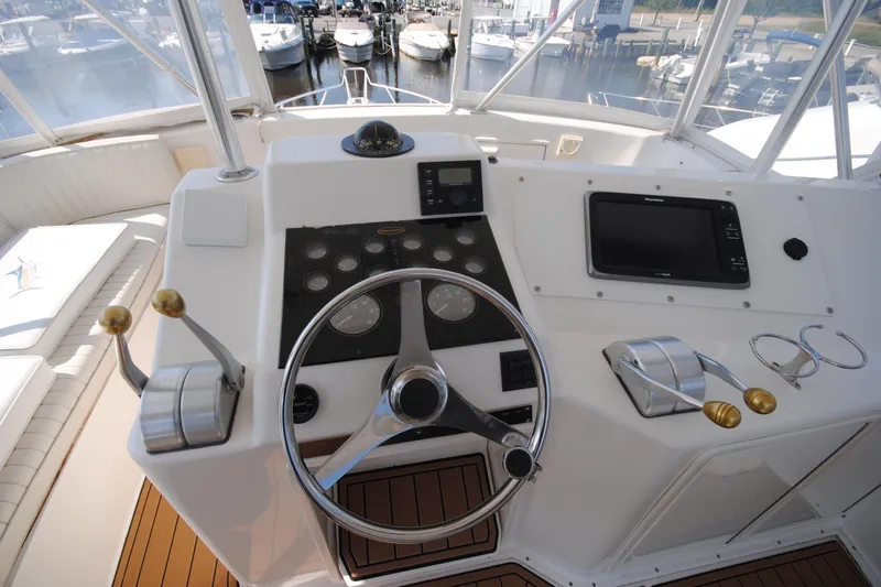  Yacht Photos Pics Helm of 1999 Ocean Yachts 45 Super Sport with steering wheel and control panel.