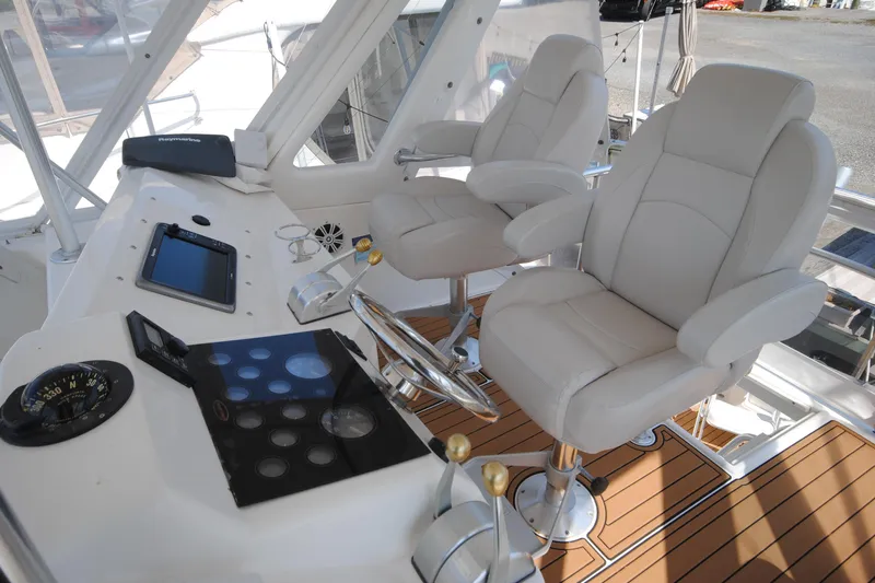  Yacht Photos Pics 1999 Ocean Yachts 45 Super Sport helm with dual captain chairs and navigation equipment.