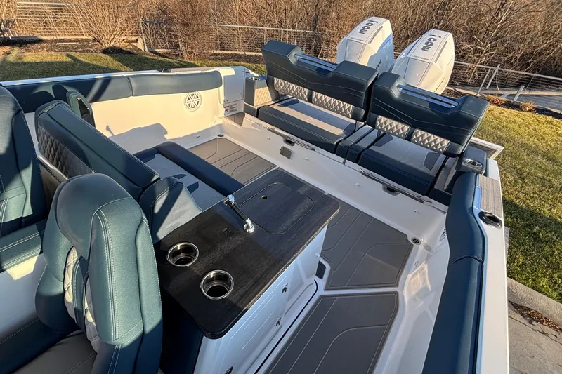  Yacht Photos Pics 2026 Monterey Elite 30 OB boat interior with luxurious seating and dual outboard engines.