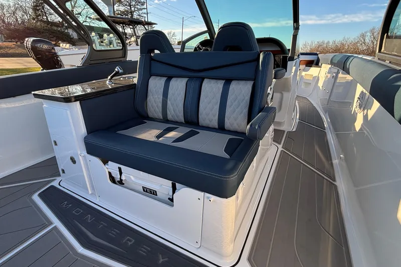  Yacht Photos Pics 2026 Monterey Elite 30 OB boat interior with luxurious seating and modern design.