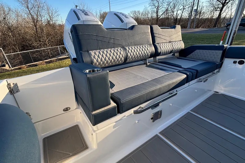  Yacht Photos Pics 2026 Monterey Elite 30 OB boat interior with luxurious seating and dual outboard engines.