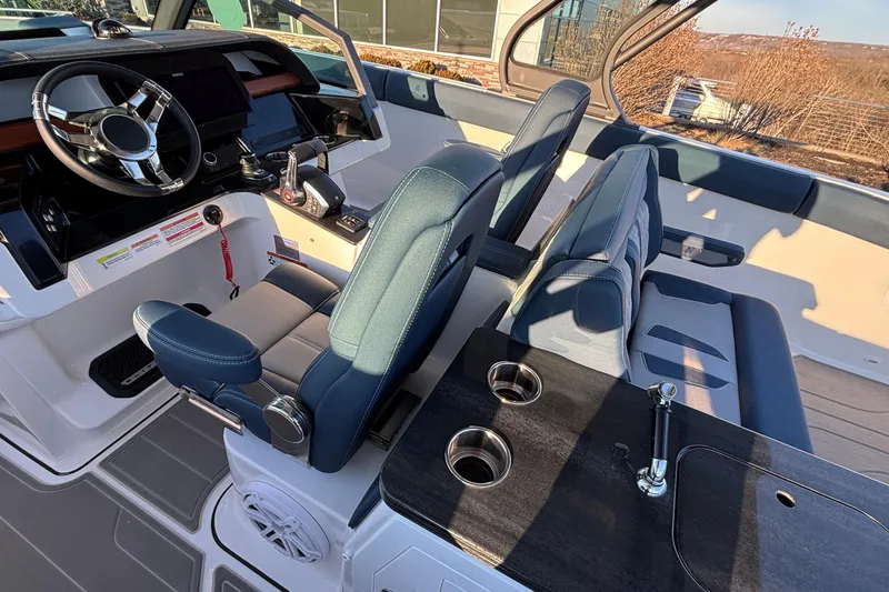  Yacht Photos Pics Interior of 2026 Monterey Elite 30 OB boat with modern helm and seating.