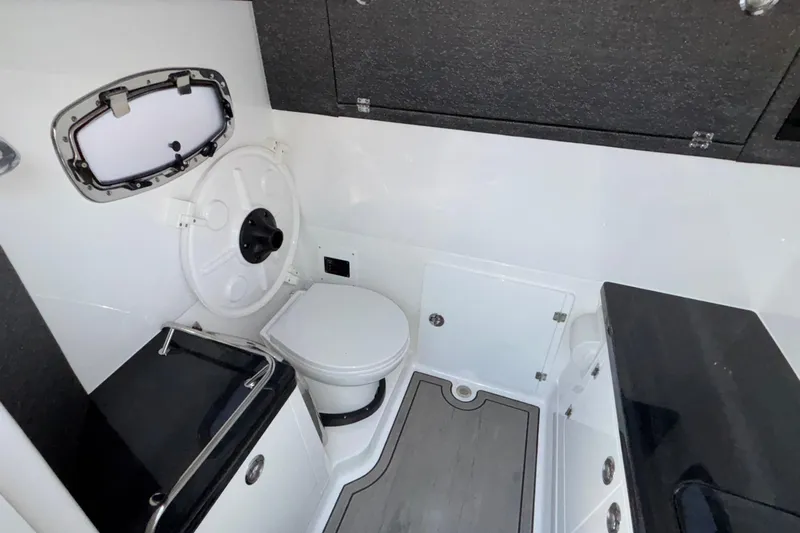  Yacht Photos Pics 2026 Monterey Elite 30 OB boat interior bathroom with modern fixtures and sleek design.