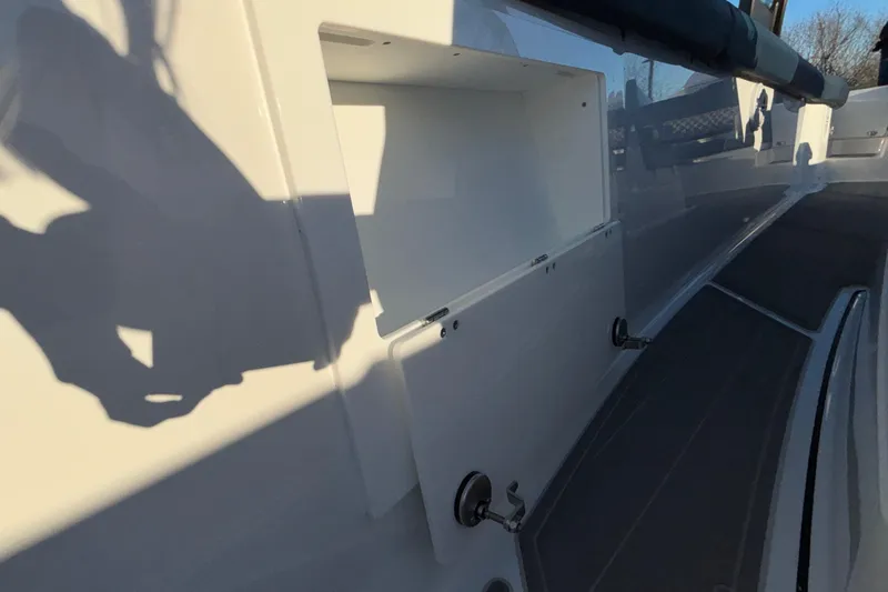  Yacht Photos Pics 2026 Monterey Elite 30 OB boat interior with storage compartment and sleek design.