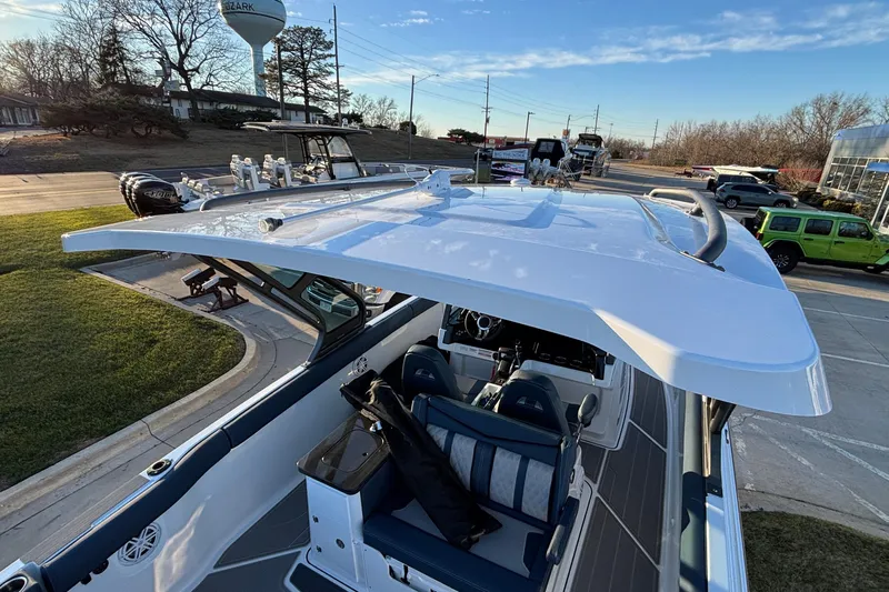  Yacht Photos Pics 2026 Monterey Elite 30 OB boat with sleek design and modern features, parked outdoors.