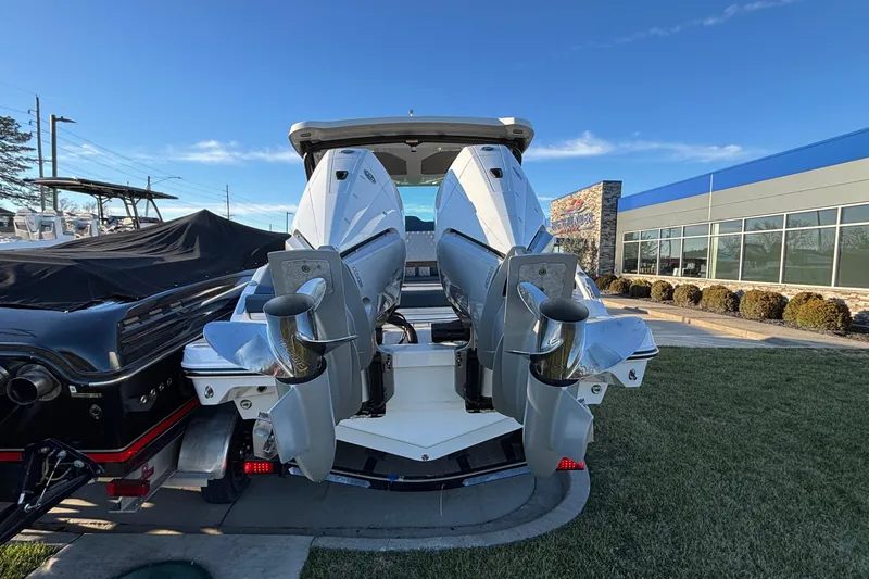  Yacht Photos Pics 2026 Monterey Elite 30 OB boat with dual outboard engines, displayed outdoors.