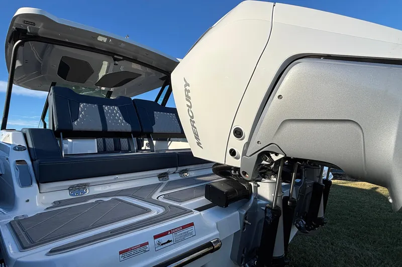  Yacht Photos Pics 2026 Monterey Elite 30 OB boat with Mercury engine, featuring sleek seating and modern design.