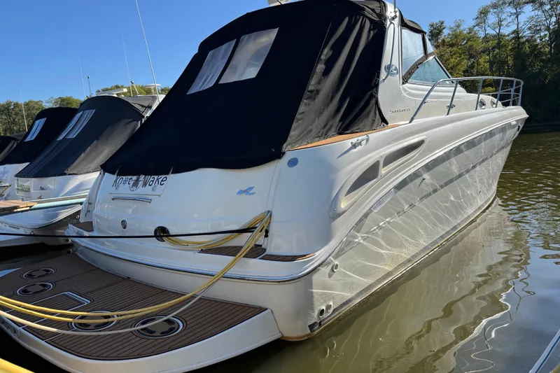  Yacht Photos Pics 2000 Sea Ray 380 Sundancer docked, featuring sleek design and black canvas cover.