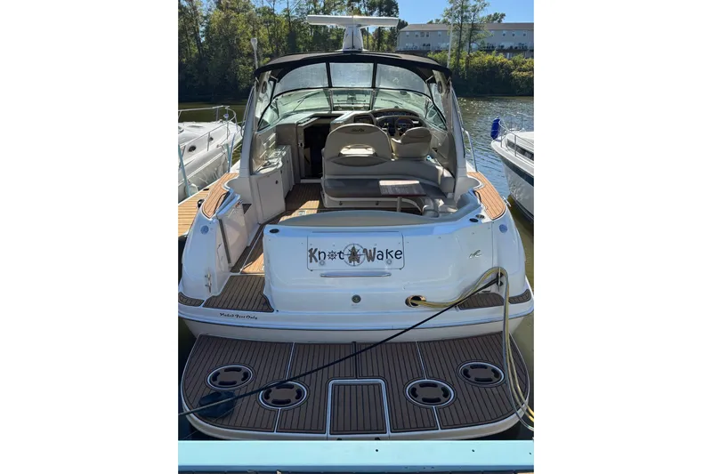  Yacht Photos Pics 2000 Sea Ray 380 Sundancer docked, rear view with open cockpit and seating.