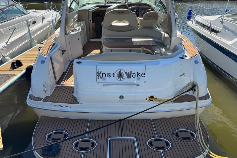  Yacht Photos Pics Sea Ray 380 Sundancer 2000 docked, featuring teak deck and "Knot Wake" nameplate.
