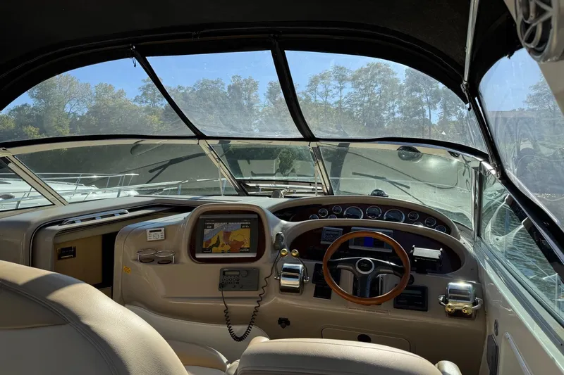  Yacht Photos Pics Interior view of 2000 Sea Ray 380 Sundancer boat cockpit with navigation equipment.