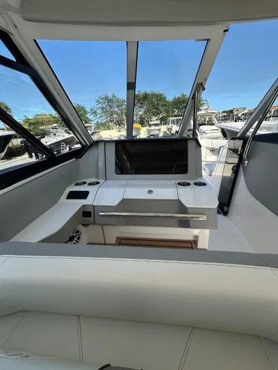 Yacht Photos Pics 2023 Regal LX36 boat interior with sleek design and modern dashboard.