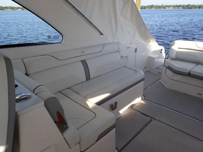  Yacht Photos Pics Luxurious interior of 2023 Regal LX36 yacht with white seating and scenic water view.