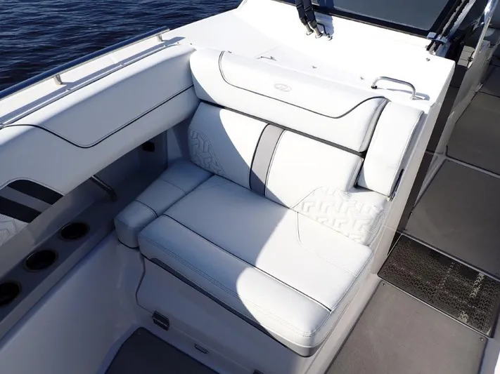 Yacht Photos Pics Luxurious seating on 2023 Regal LX36 boat, featuring elegant white upholstery and modern design.
