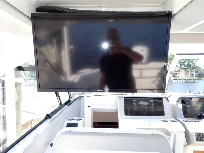  Yacht Photos Pics 2023 Regal LX36 boat helm with large screen display and modern controls.