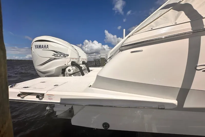  Yacht Photos Pics 2023 Regal LX36 boat with Yamaha XTO outboard engine on a sunny day.