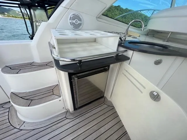  Yacht Photos Pics 2012 Sea Ray 500 Sundancer yacht interior with kitchenette and steps.