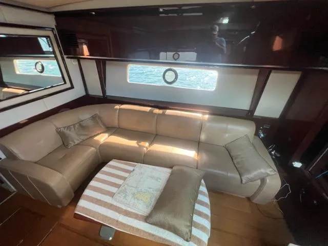  Yacht Photos Pics Luxurious interior of 2012 Sea Ray 500 Sundancer yacht with leather seating and elegant decor.