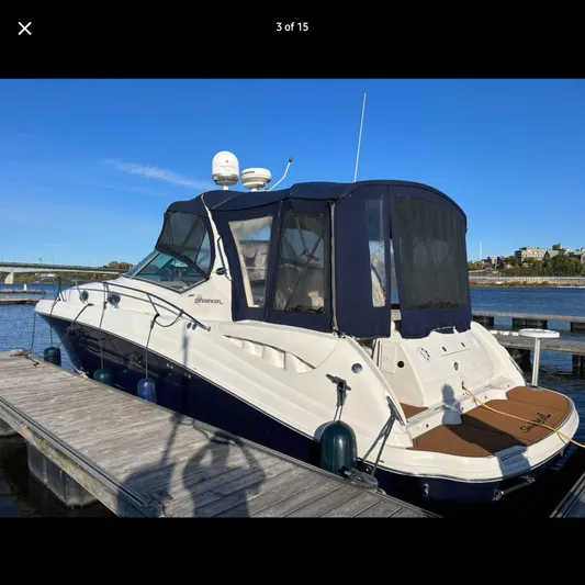  Yacht Photos Pics 2005 Sea Ray 340 Sundancer docked at marina under clear blue sky.
